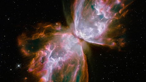 Gas released by a dying star races across space at more than 600,000 miles an hour, forming the delicate shape of a celestial butterfly. This nebula is also known as NGC 6302 or the Bug Nebula.